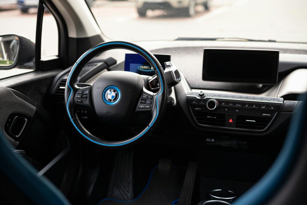 Sleek and modern interior of a car showcasing a detailed view of the steering wheel.