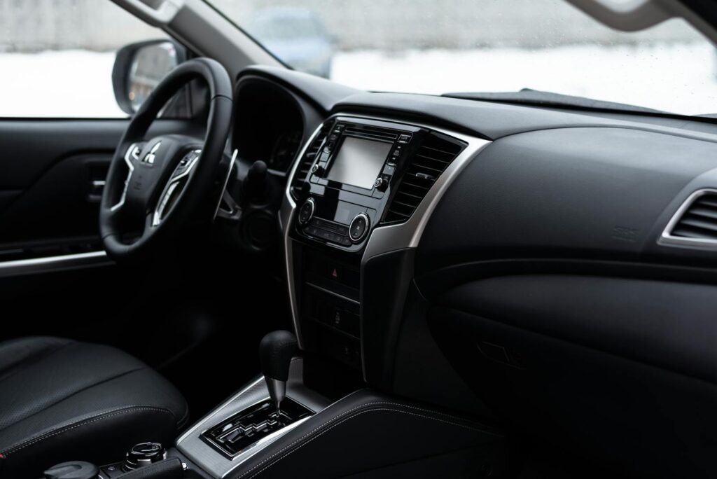 Sleek and contemporary Mitsubishi L200 interior featuring the dashboard and steering wheel.