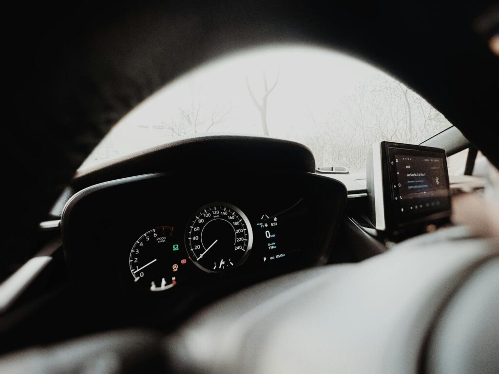 Interior view of a modern car dashboard with digital display and speedometer, captured in Tianjin, China.