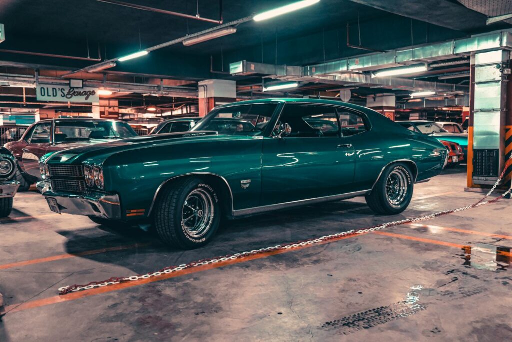Classic green car parked in an underground garage in Ankara, showcasing vintage automotive style.