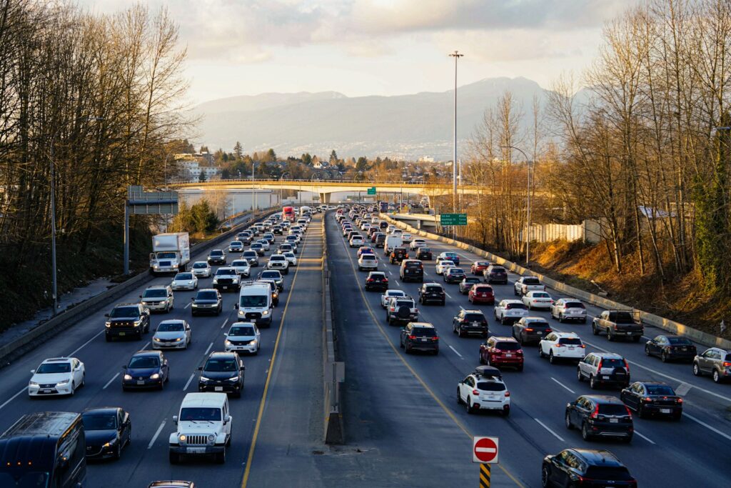 Highway is experiencing heavy traffic with many cars.