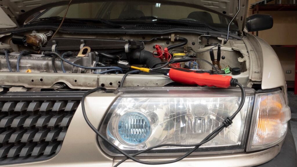 a close up of the front of a car with its hood open