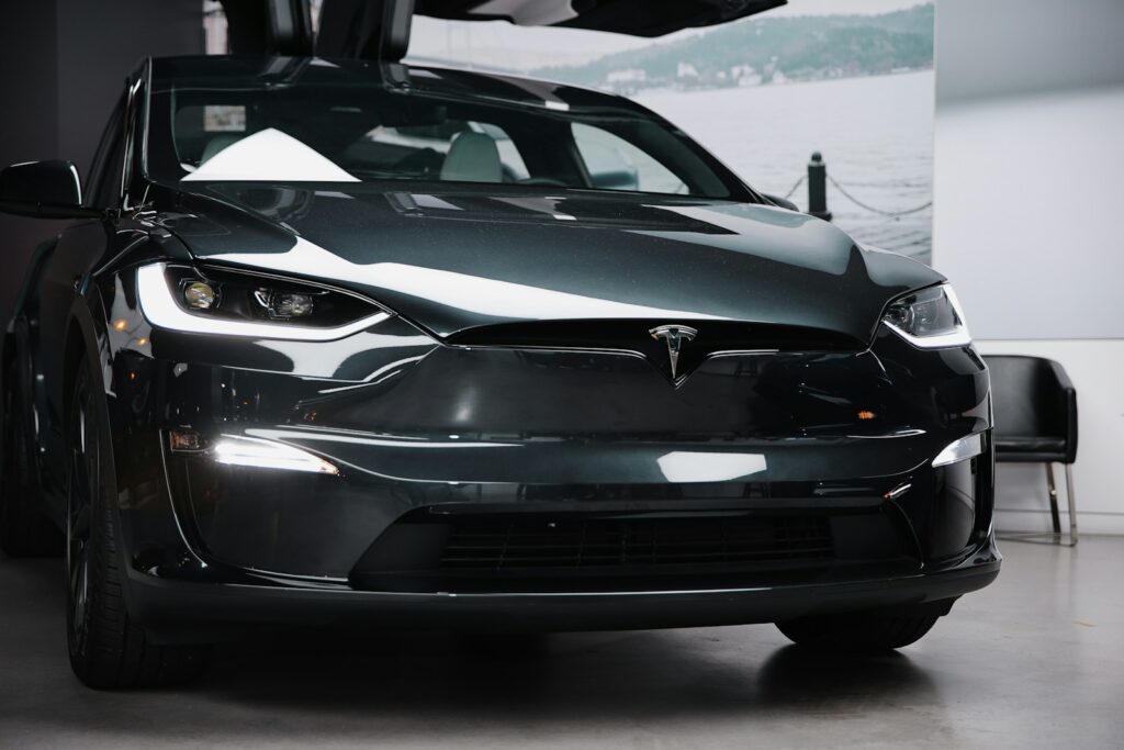 A black car is parked in a garage