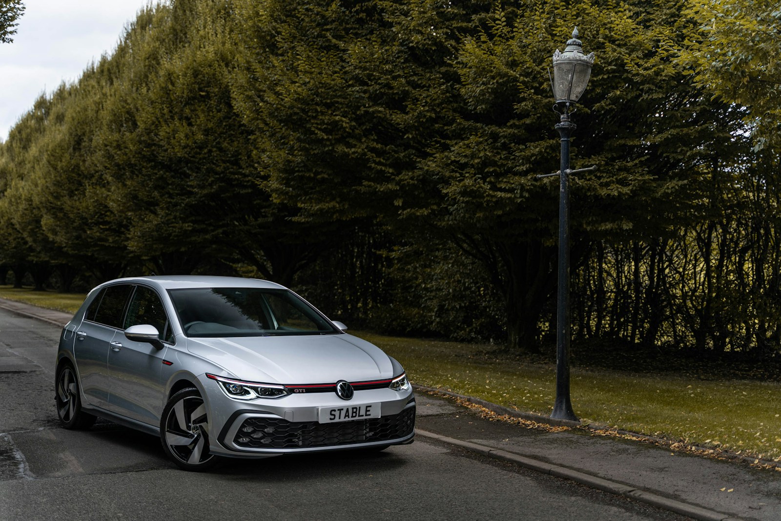 a silver car parked on a road