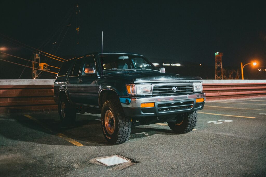black chevrolet crew cab pickup truck on parking lot during night time
