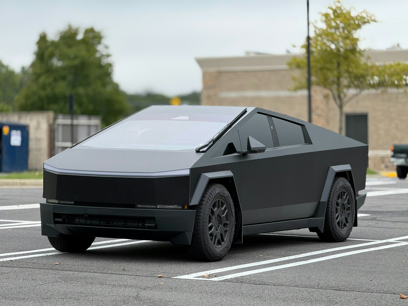 A futuristic car is parked in a parking lot