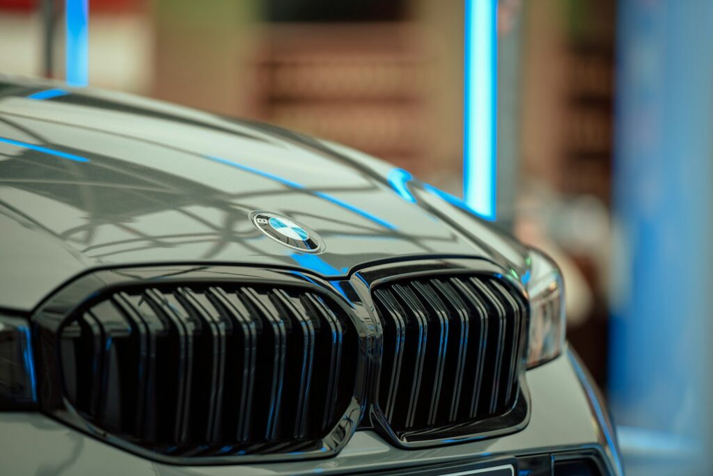 Close-up of a modern car grille with BMW logo.