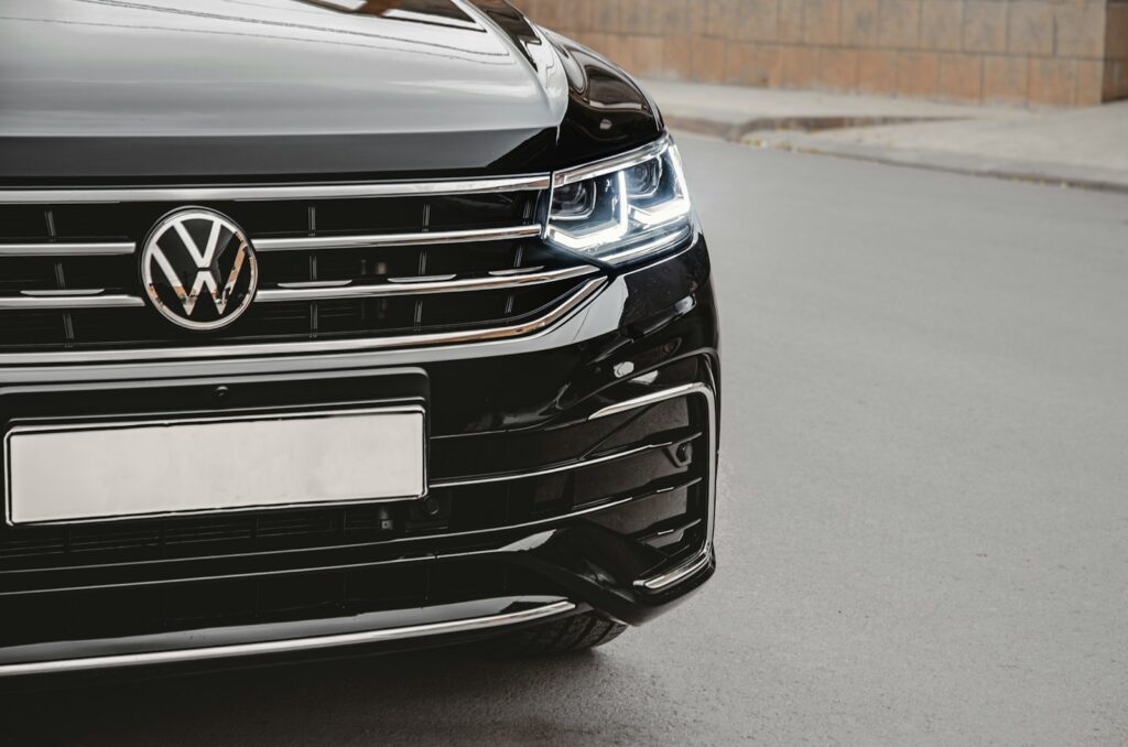 a close up of the front of a black volkswagen suv