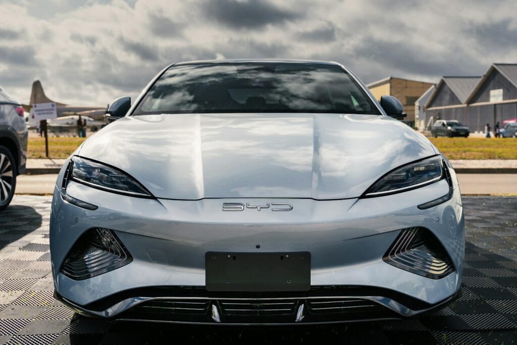 A silver sports car parked in a parking lot