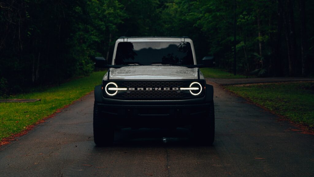a black jeep is parked on the side of the road