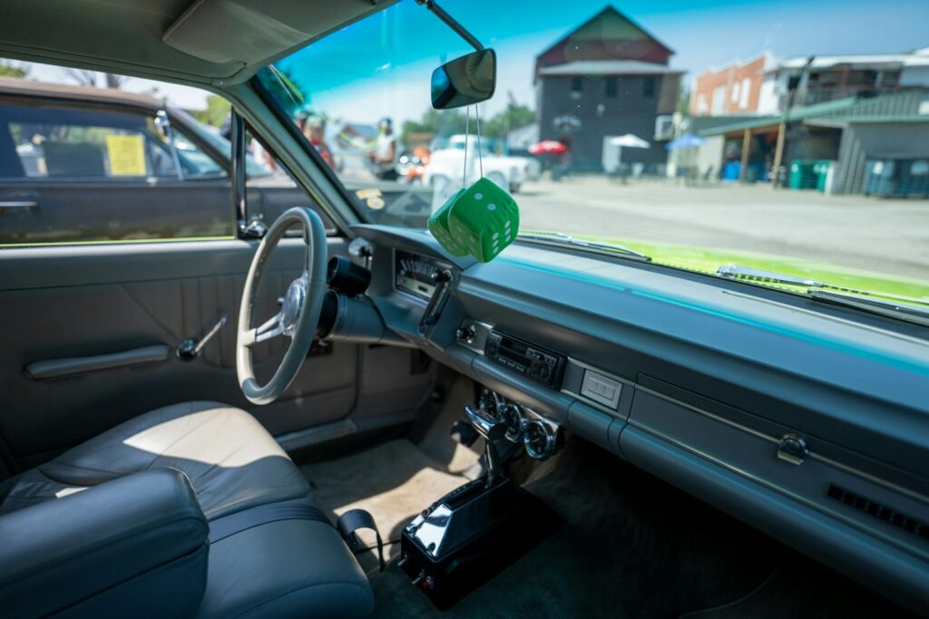 Explore the vintage car interior with hanging dice in Nelson, Wisconsin.