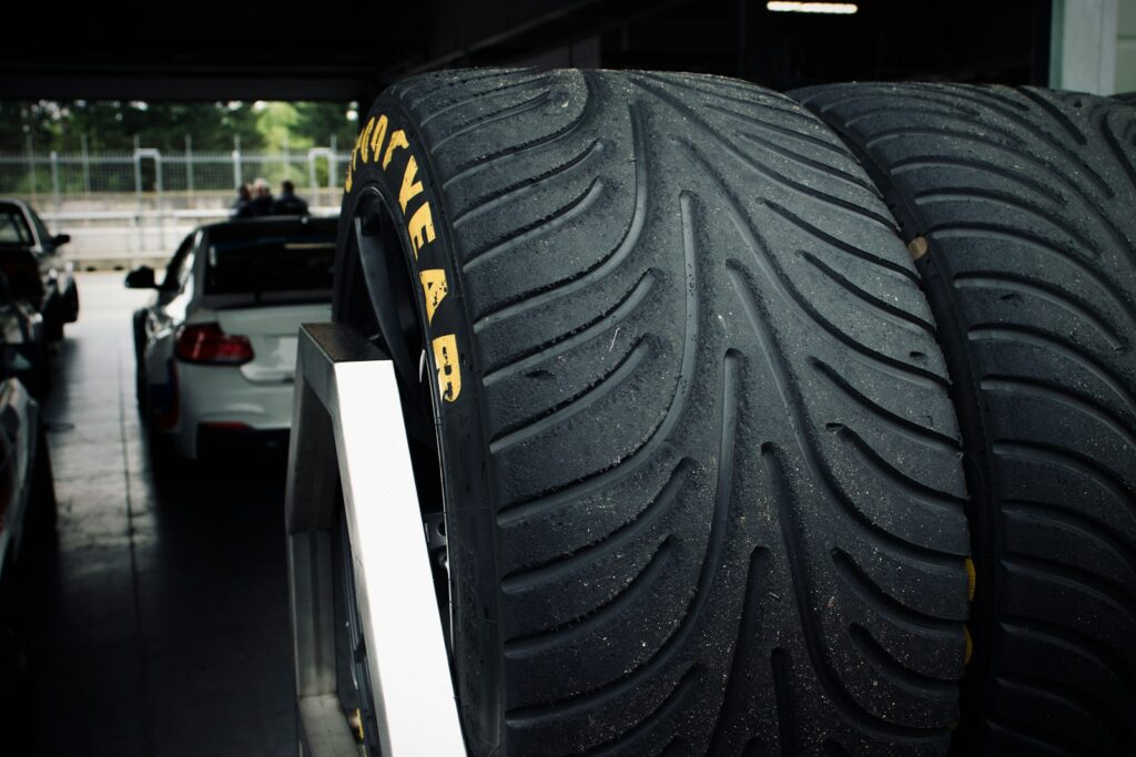 a couple of tires that are sitting on a rack
