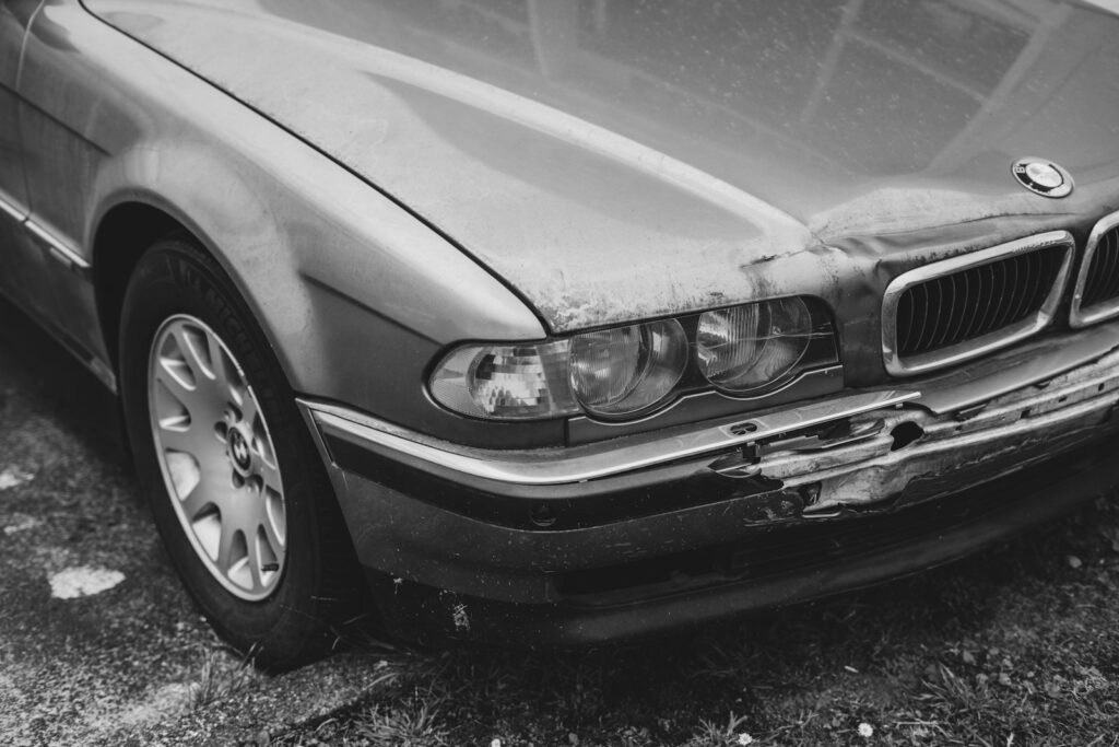 A car that is sitting in the grass