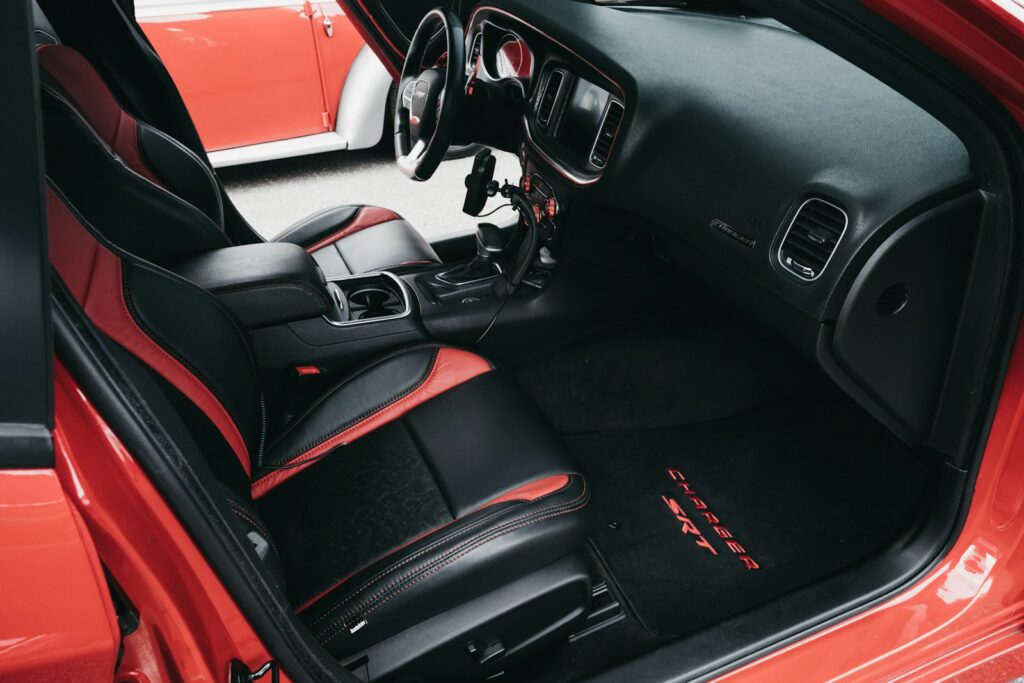 the interior of a red sports car