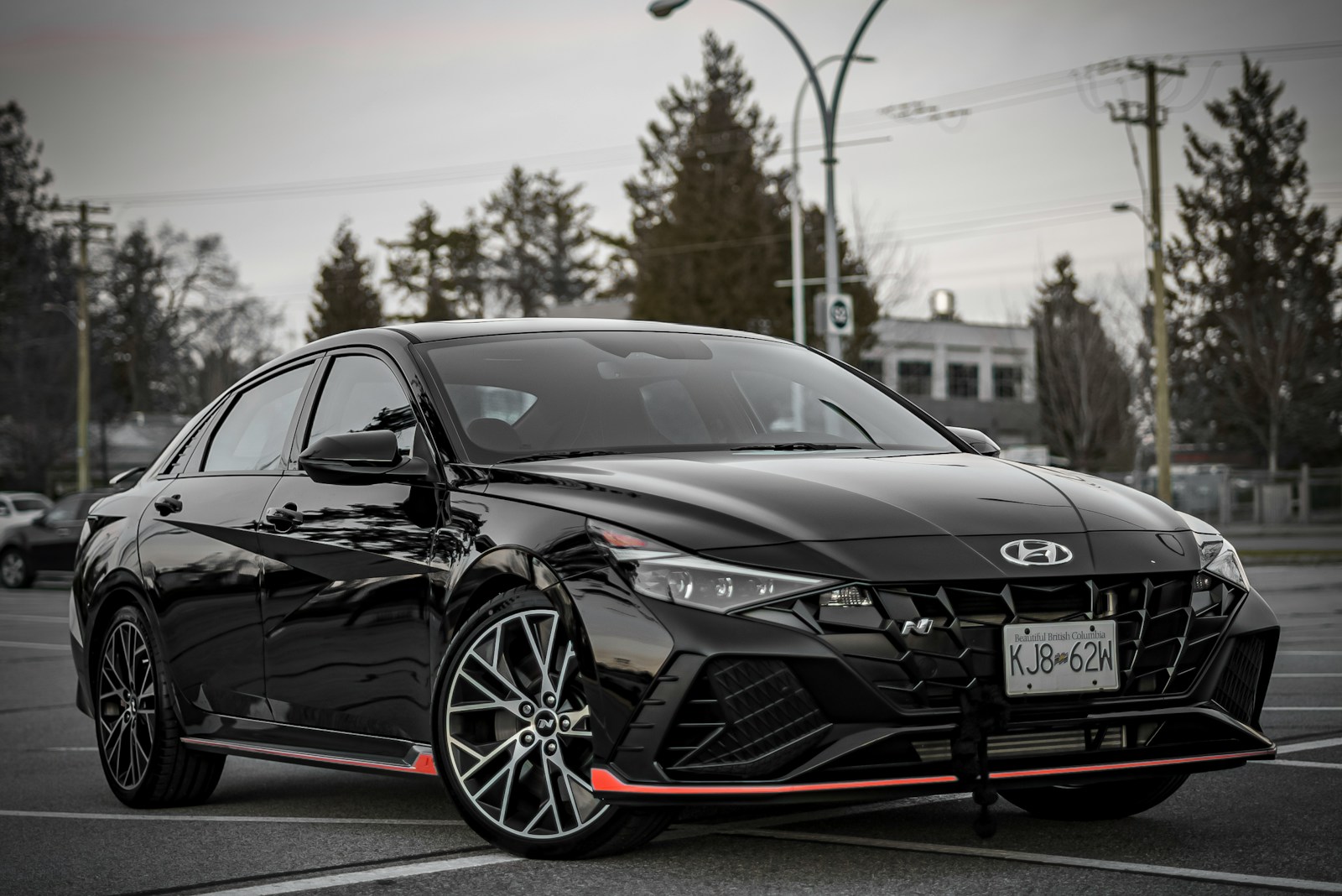 a black car parked in a parking lot