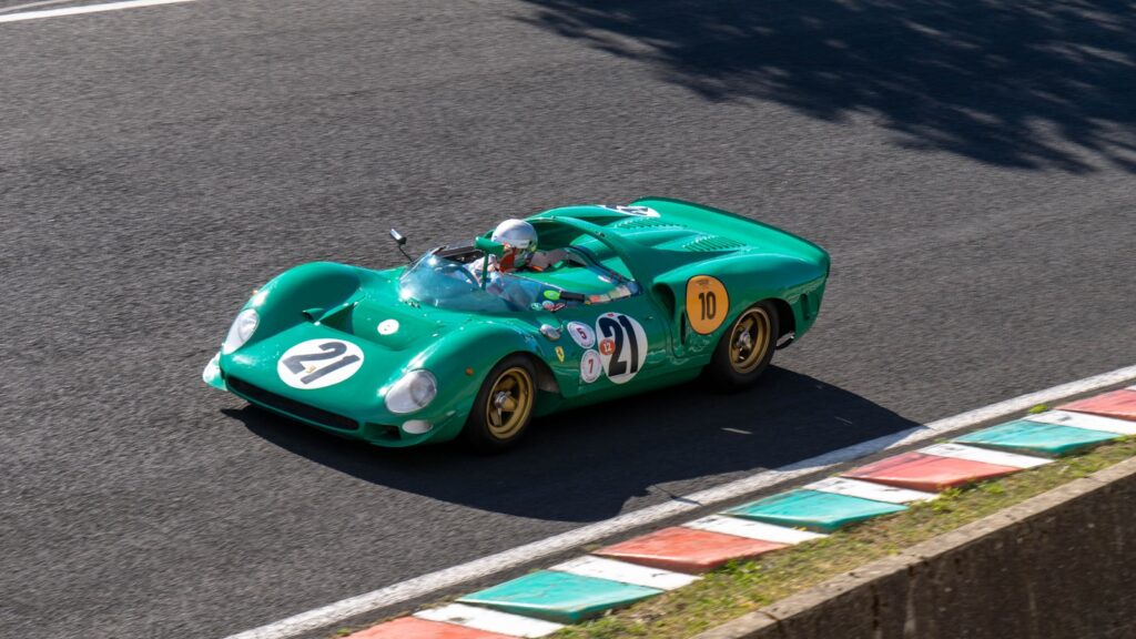blue and white porsche 911 on road during daytime