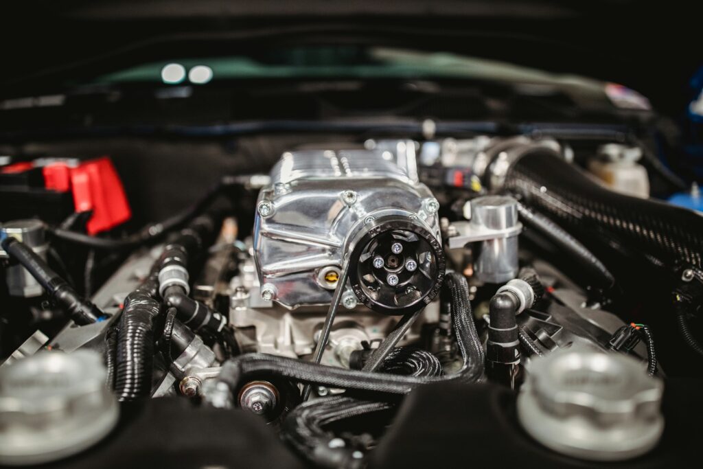 shallow focus photo of car engine bay