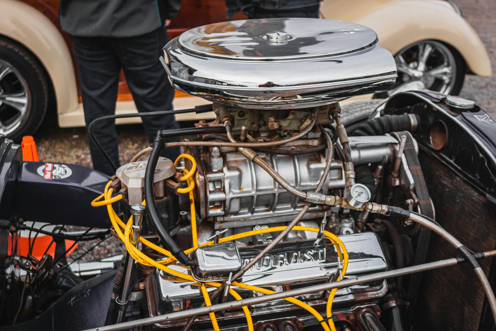 Close-up view of a chrome car engine highlighting intricate design and engineering.