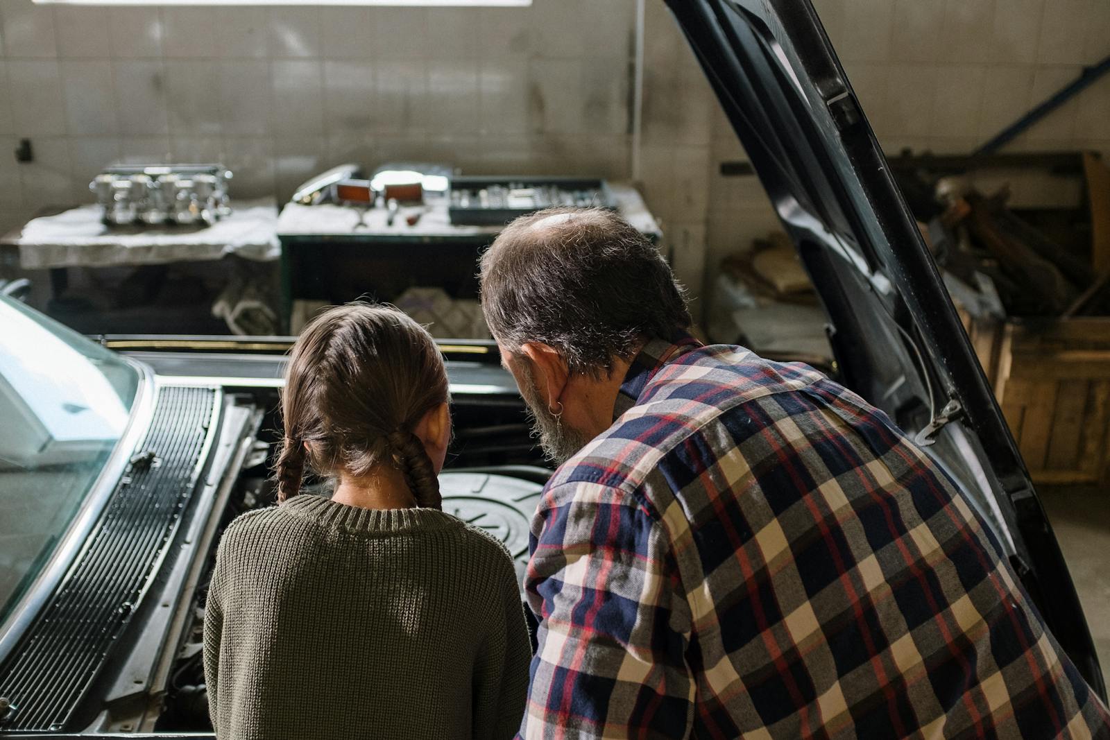 Father-Daughter Restoration Project Painting Their Finished Coupe Watched the Single-Stage Run on the Driver’s Door — They’d Skipped the Tack Rag Pass and the Whole Door Has to Come Off