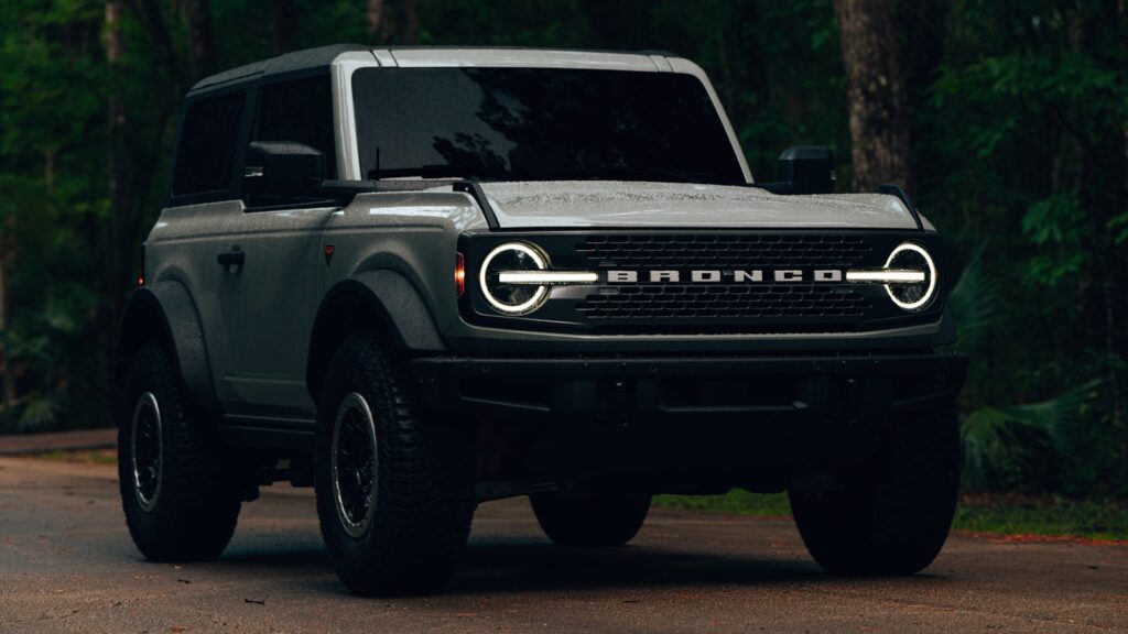 a grey truck parked on the side of a road