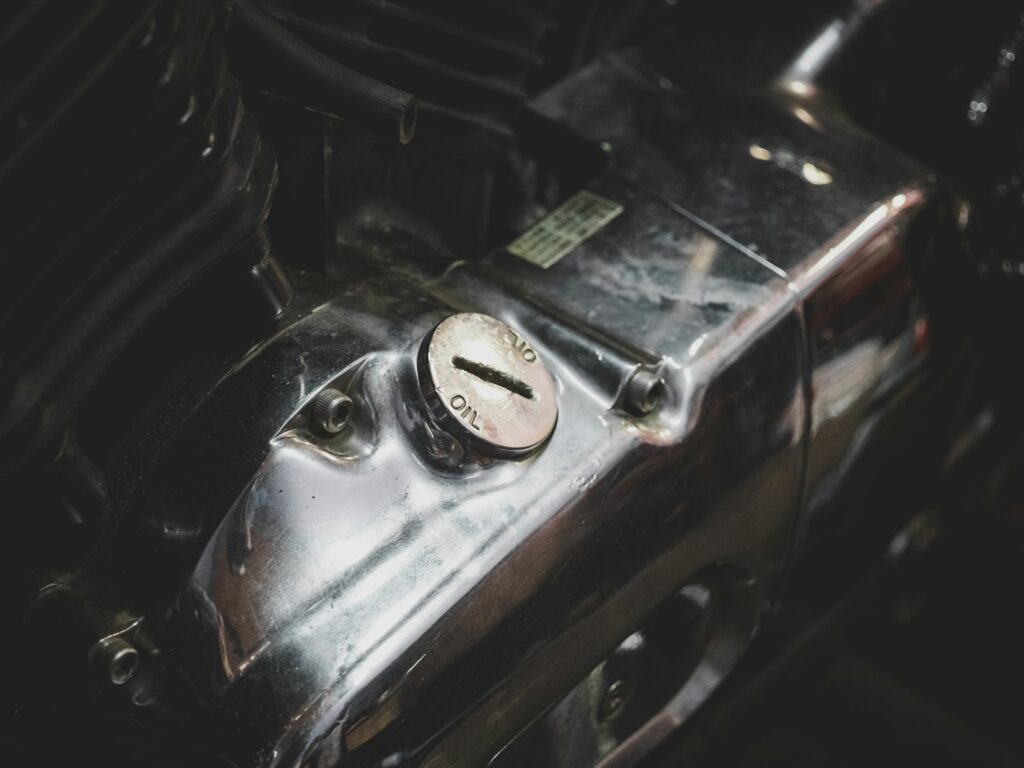 a close up of a metal object with a clock on it