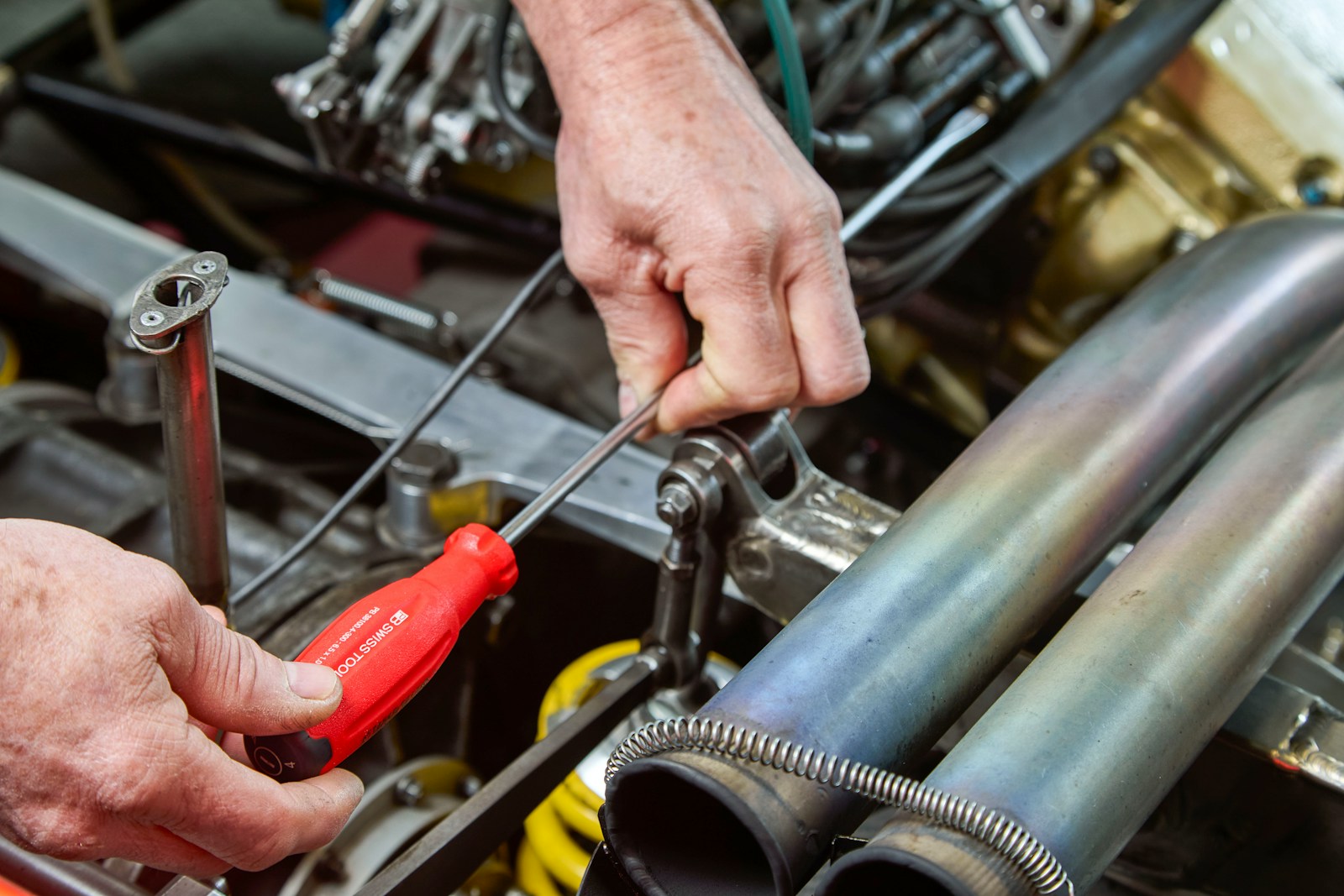 Mechanic Walked the Customer Into the Bay to Show Him a Screwdriver Wedged Into His Transmission Linkage — The Last Person to Drive the Car Was His Stepson