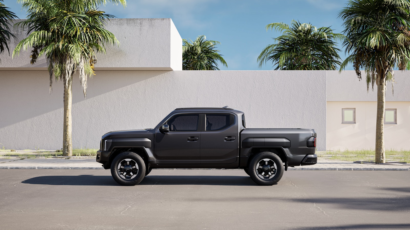A black truck is parked in a parking lot