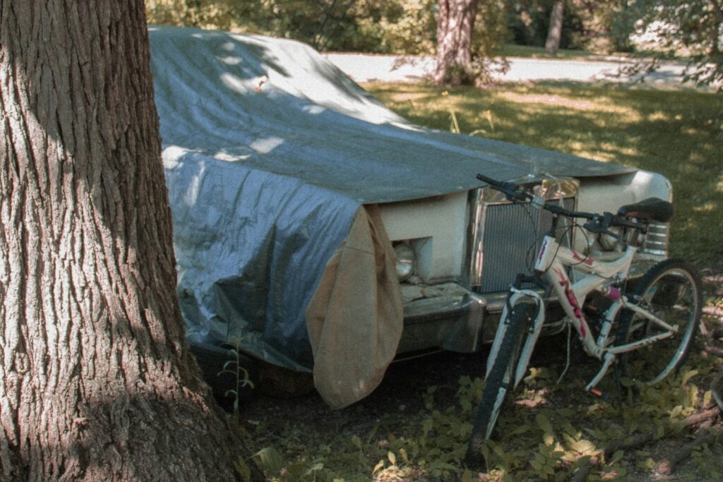 a bicycle parked next to a tent