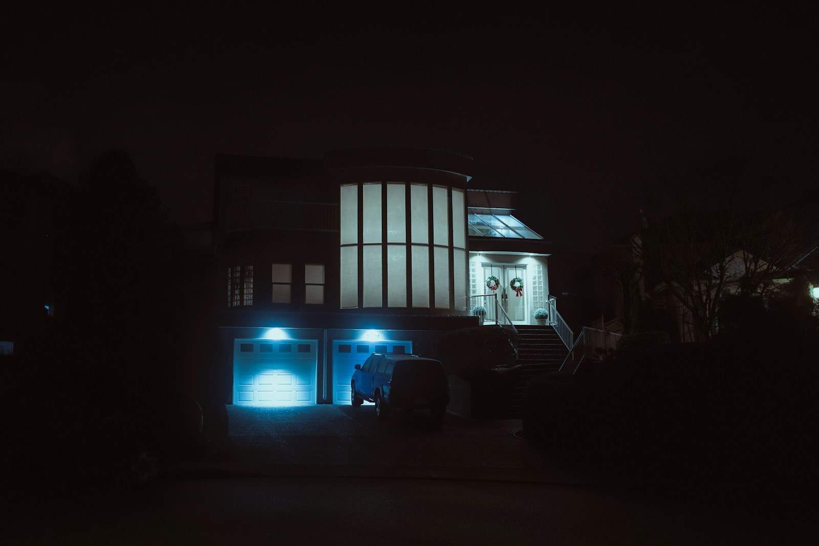 Modern house with blue lights at night