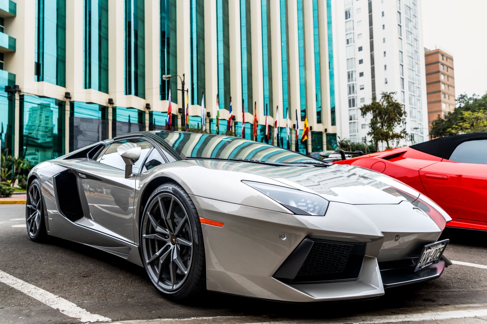 Man Parked His Supercar Across Two Spaces, Then A Rusted Work Van Boxed Him In So Tight He Had To Call His Date For Help