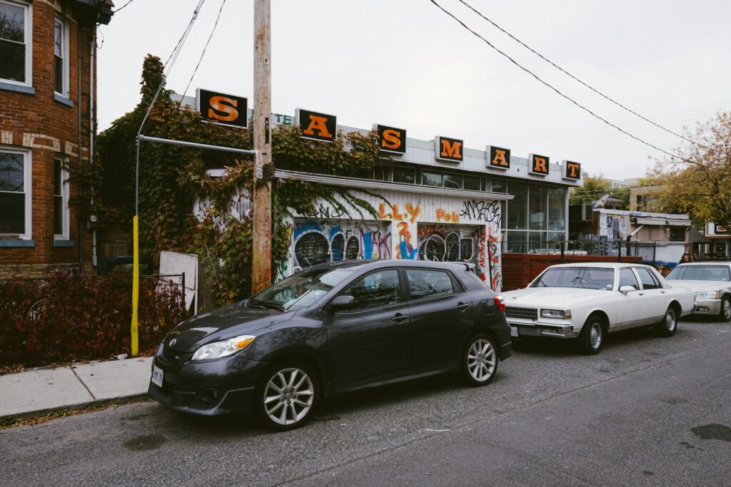 Several cars parked on the side of the road