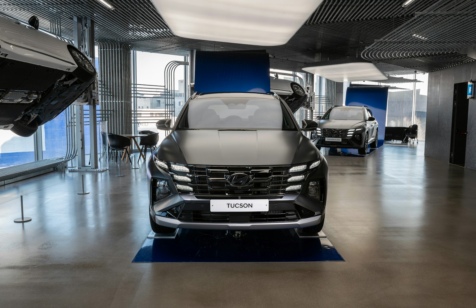 a couple of cars parked in a garage