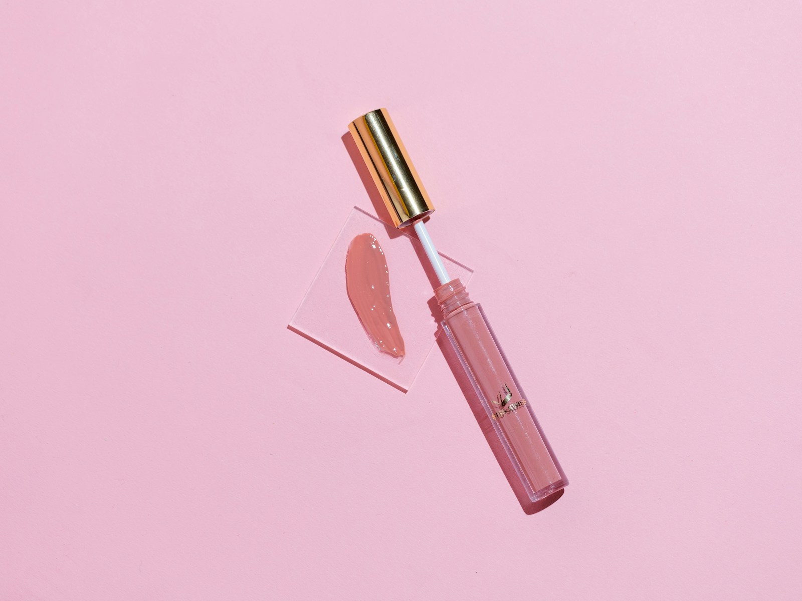 pink lipstick on pink surface