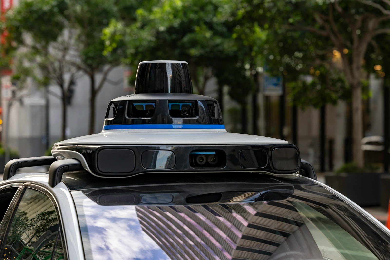 Self-driving car with sensors on city street