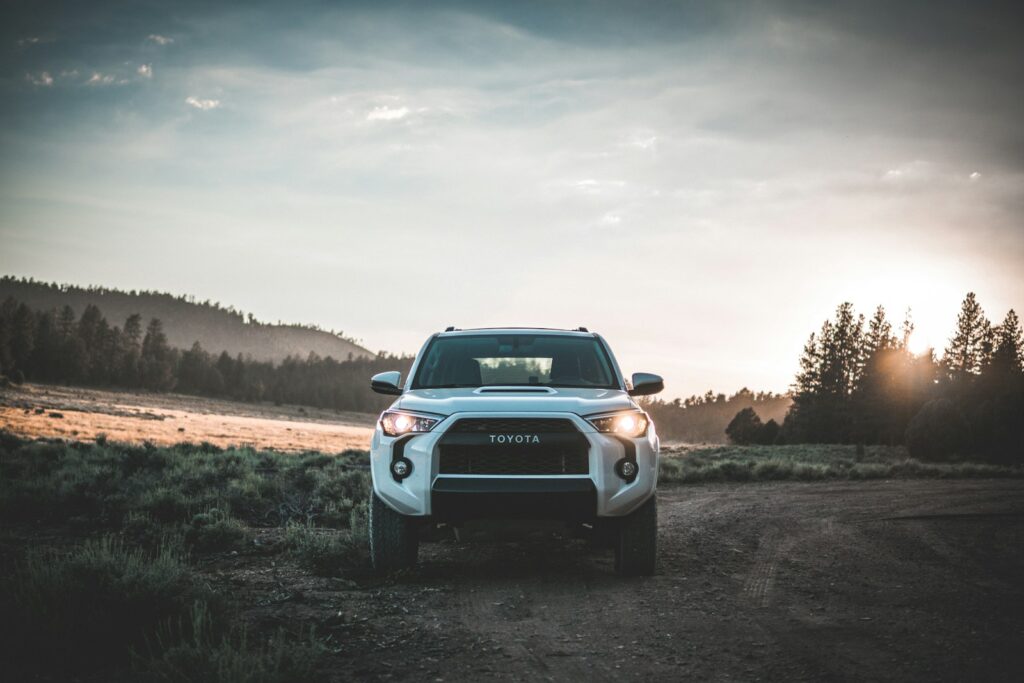 parked white Toyota vehicle