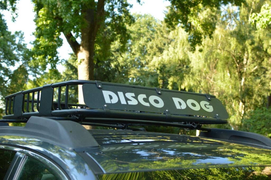 Car roof rack with a "disco dog" sign