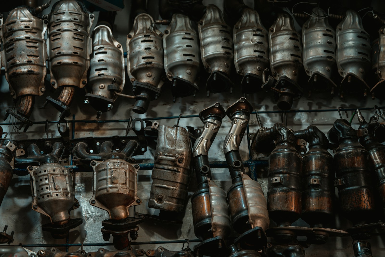 A bunch of metal objects hanging on a wall