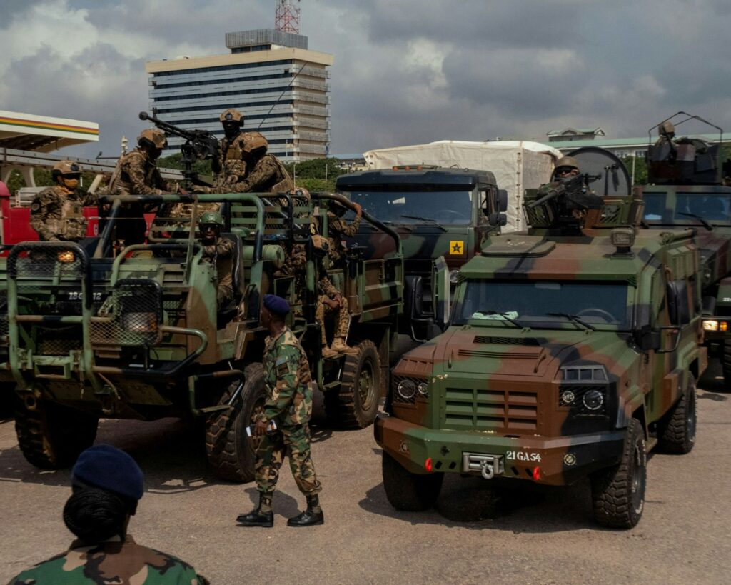 Soldiers with military vehicles on a street