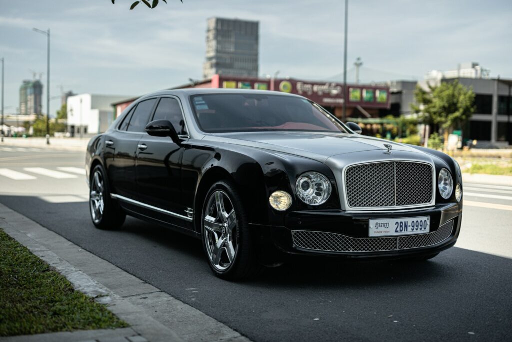black mercedes benz coupe on road during daytime