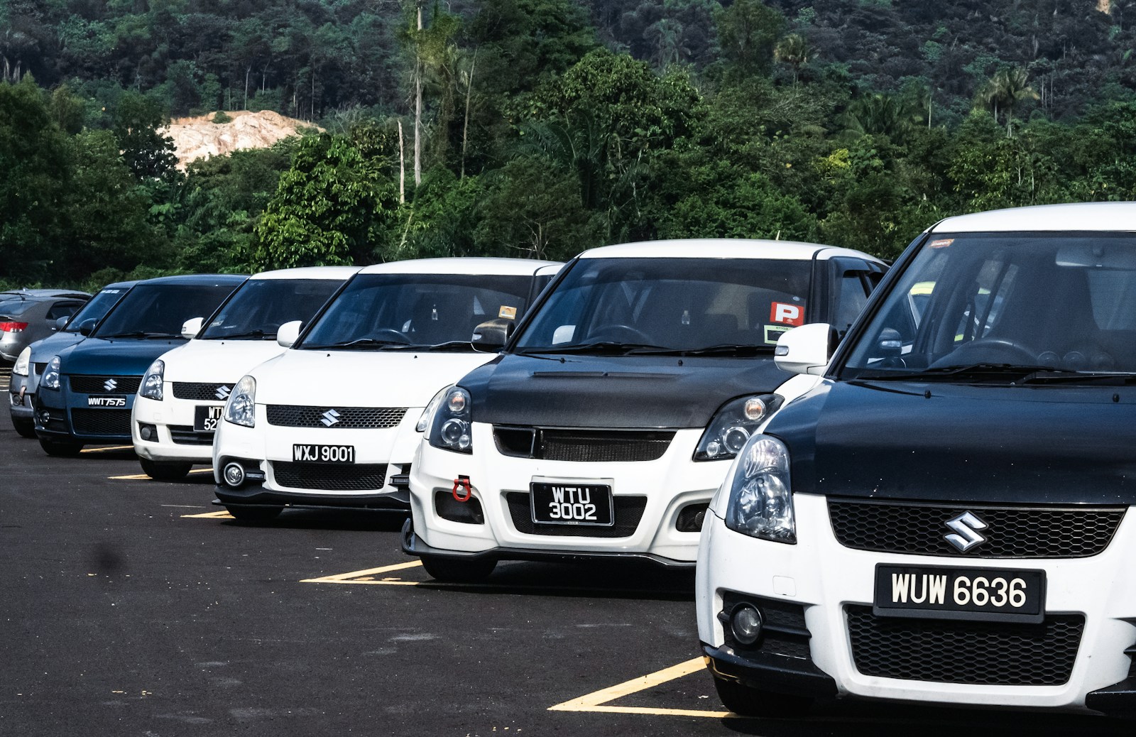 a group of cars parked in a parking lot