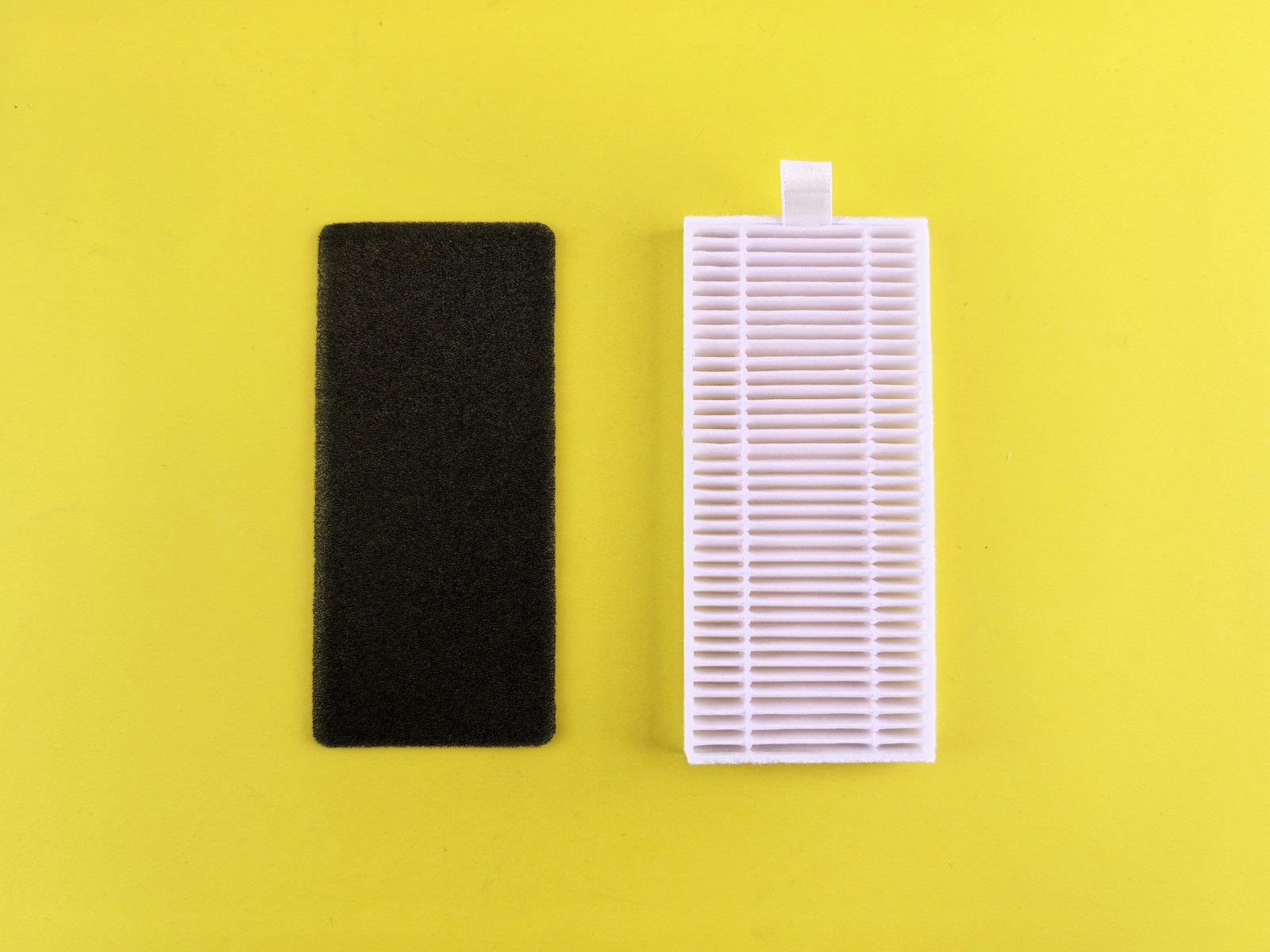 Black filter next to a white filter on yellow background