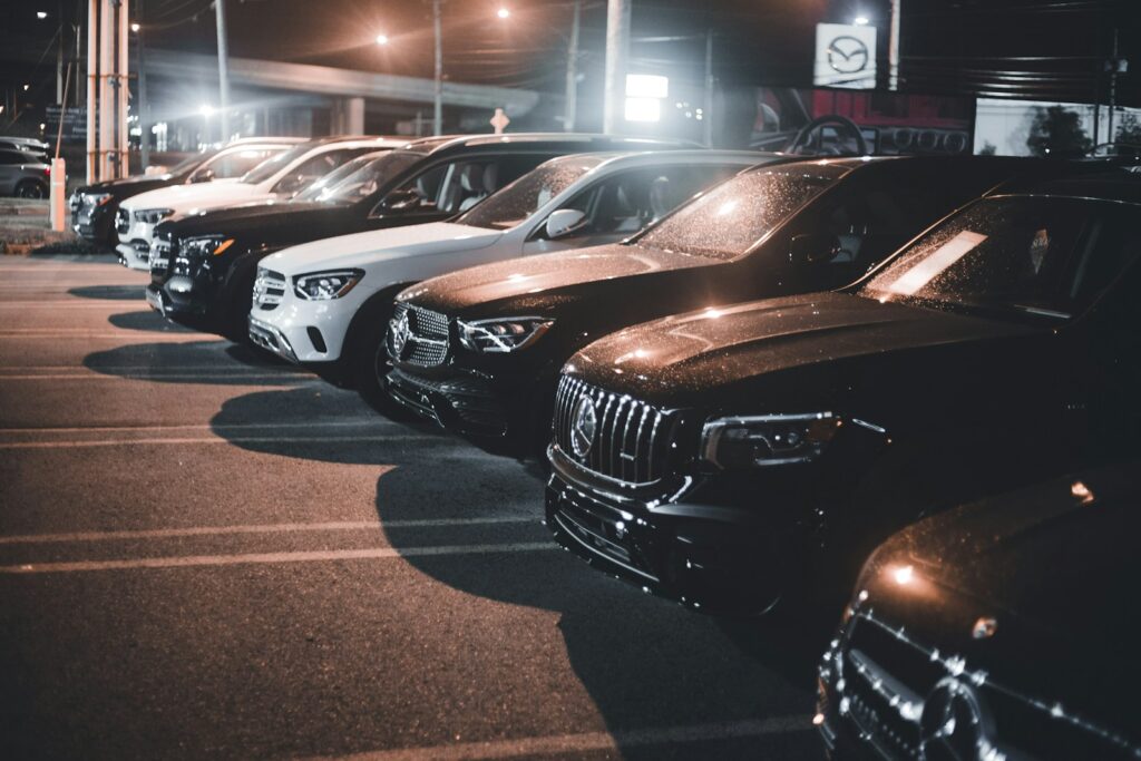 a row of cars parked in a parking lot