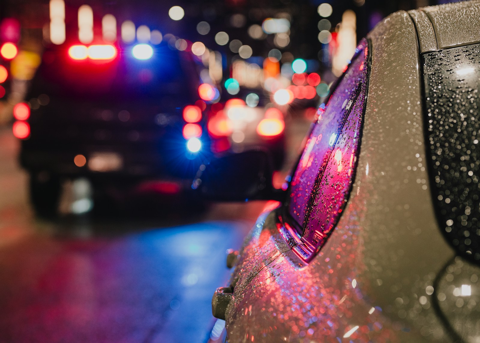 Police car with flashing lights on city street