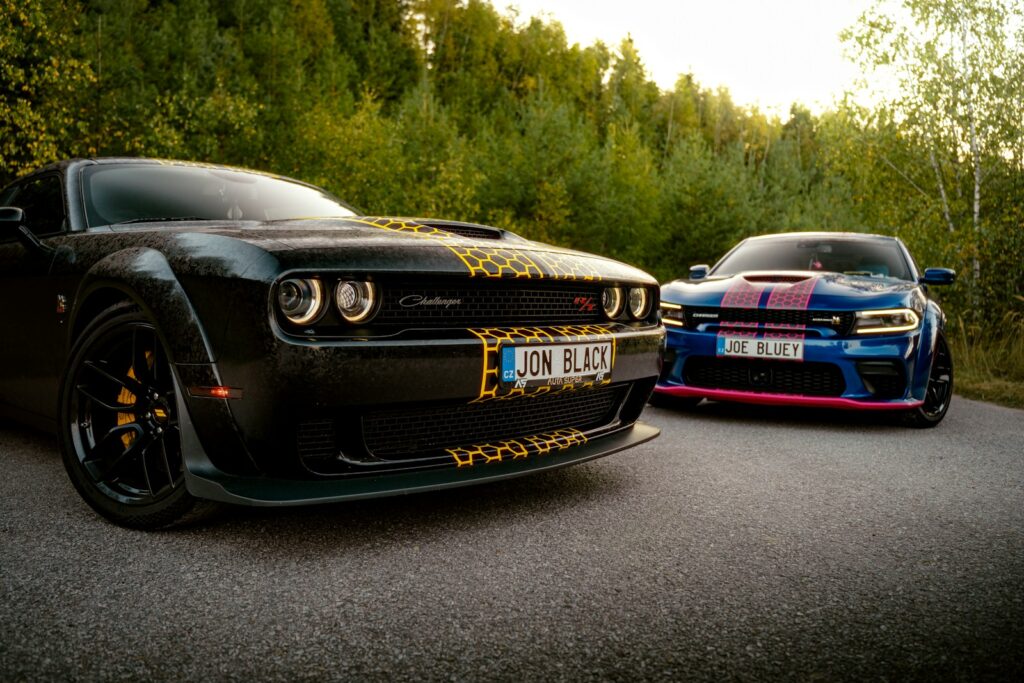 A couple of cars parked on the side of a road