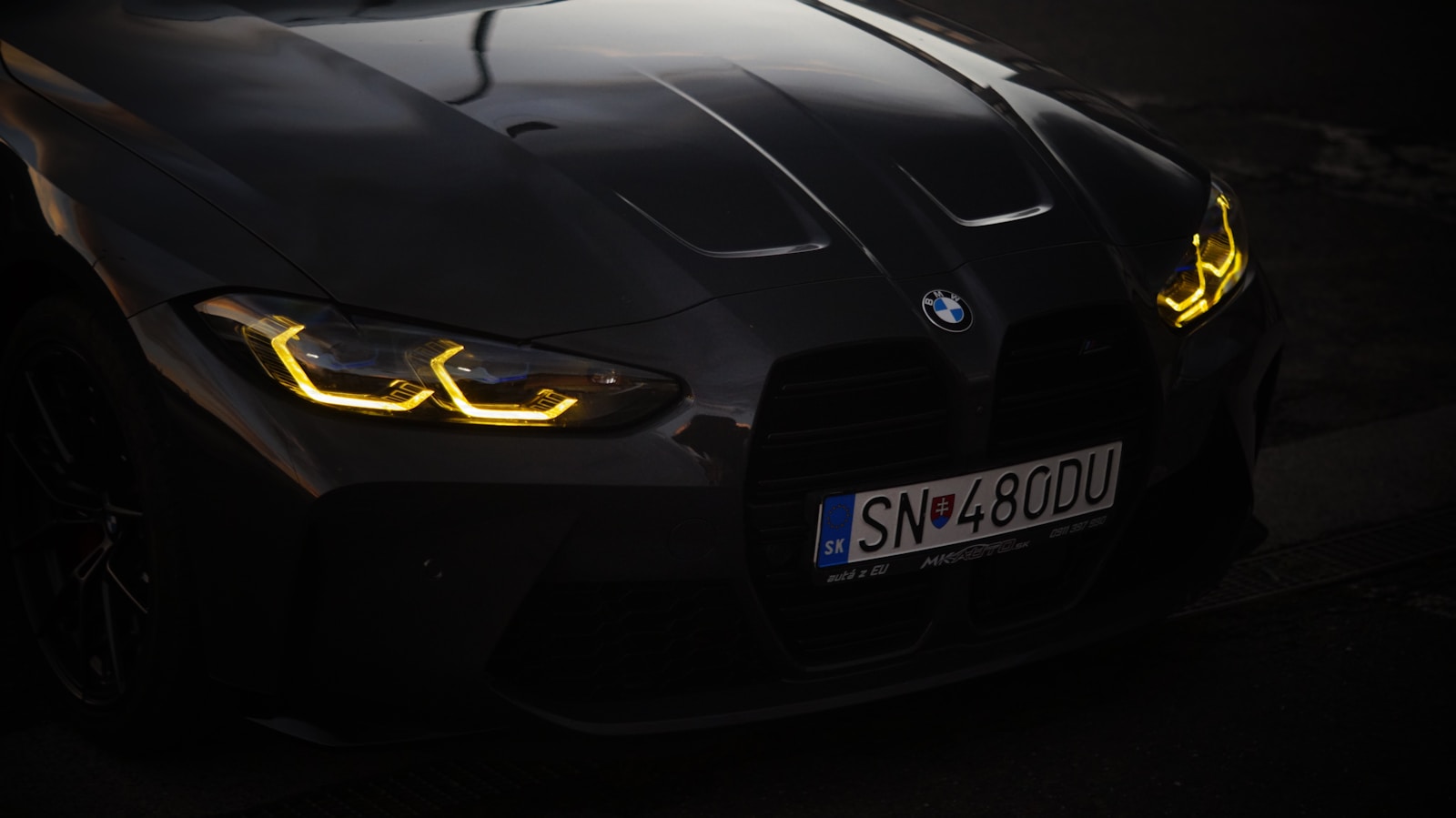 A black sports car with yellow lights on it