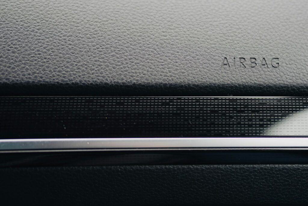 Close-up of a car's dashboard, showing "airbag."
