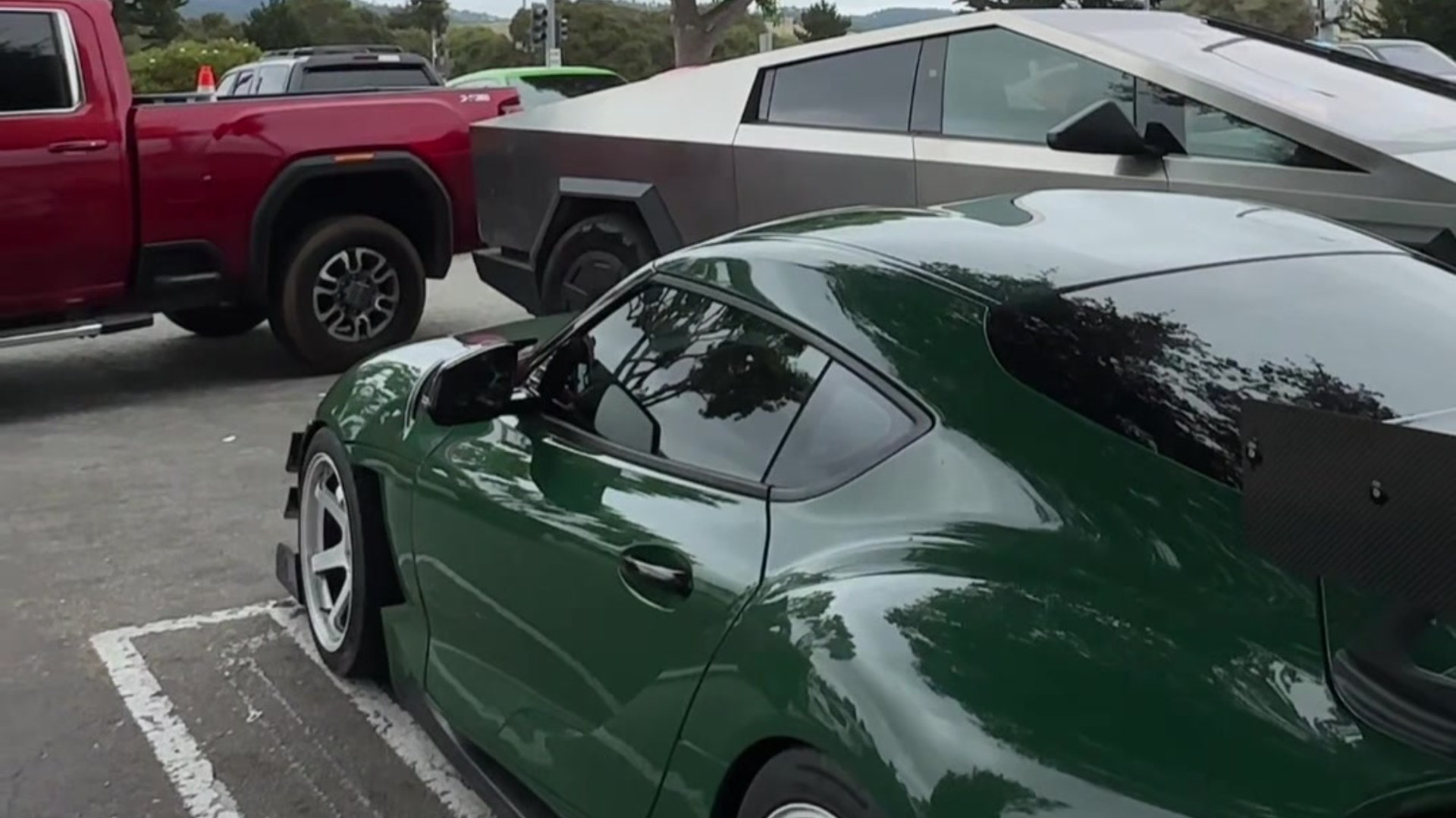 One Brand New Cybertruck Tried to Squeeze Into a Tight Parking Spot at a Major Car Week Event and Came Within Inches of Four Different Six Figure Cars Before It Finally Backed Off