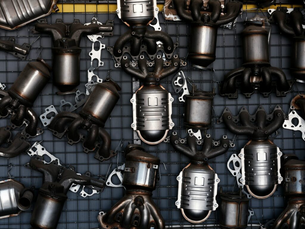 Collection of car exhaust catalytic converters and parts