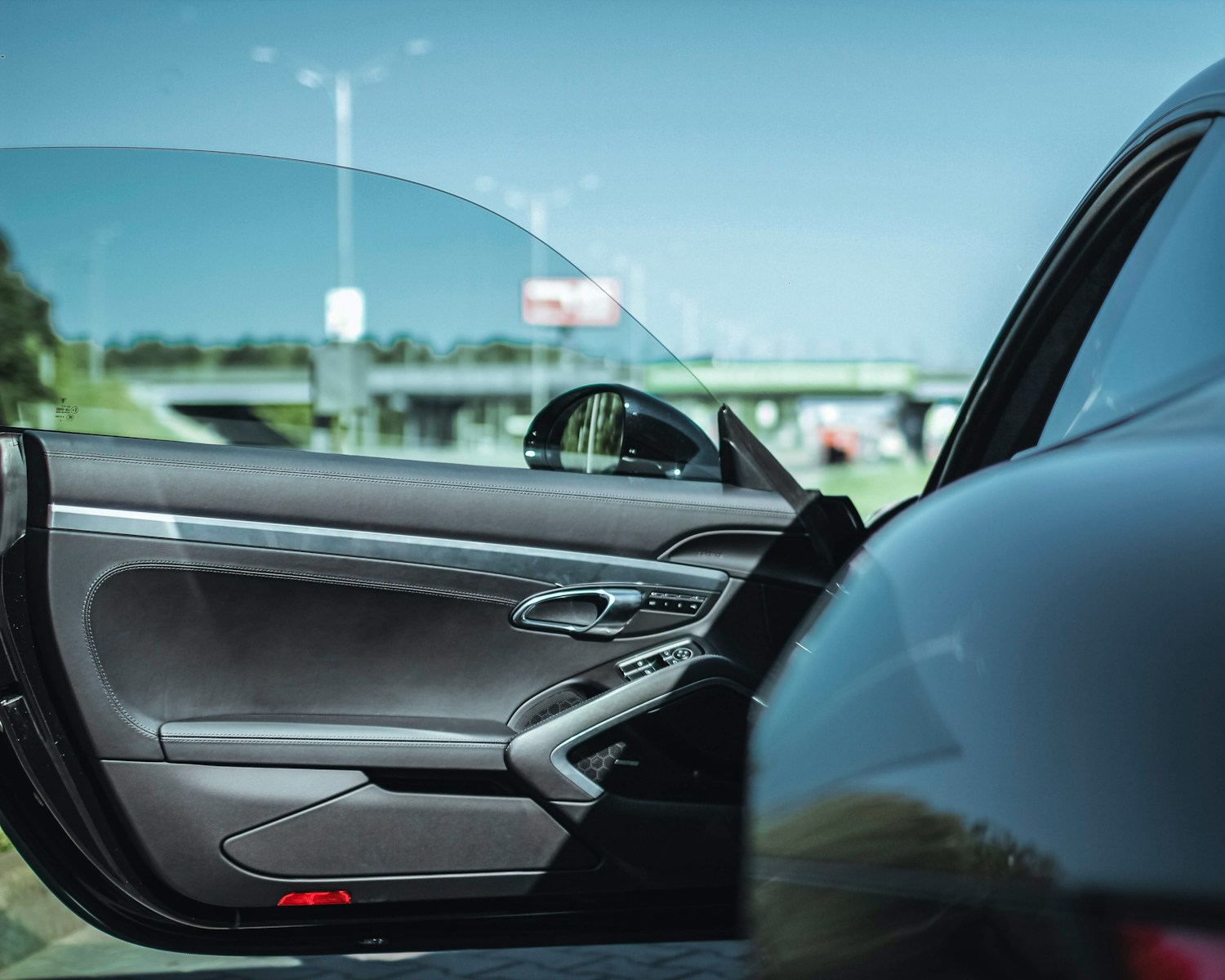 opened black vehicle's door