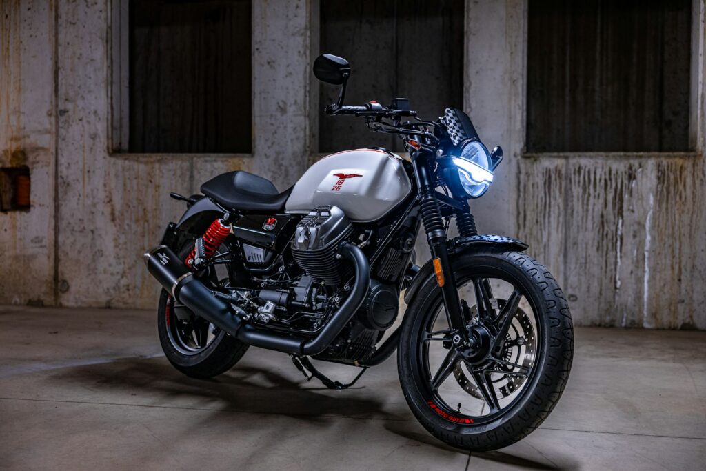 A modern white motorcycle parked indoors
